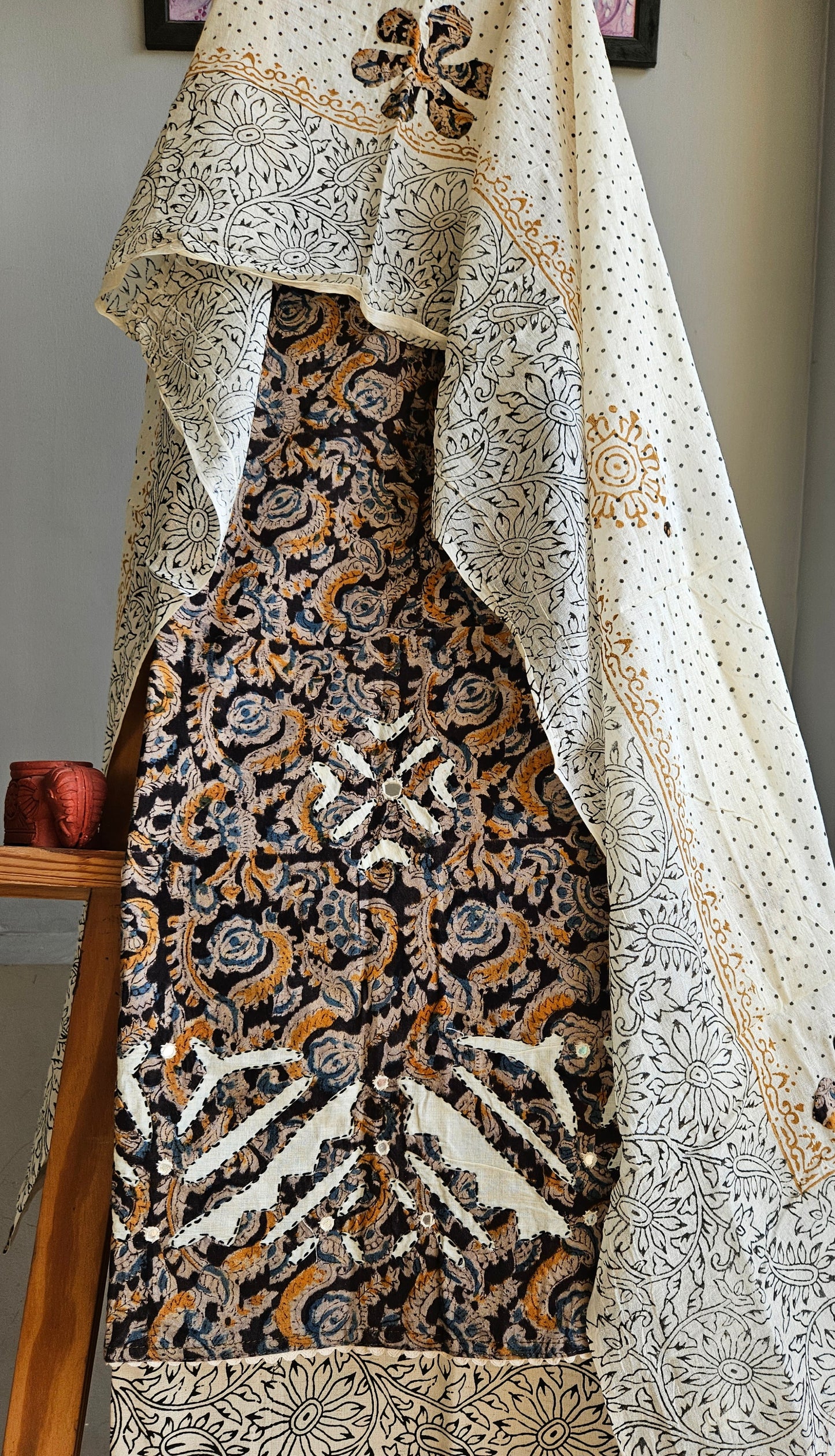 Pure cotton black,mustardand blue intricately designed kalamkari suit with applique work on ghera